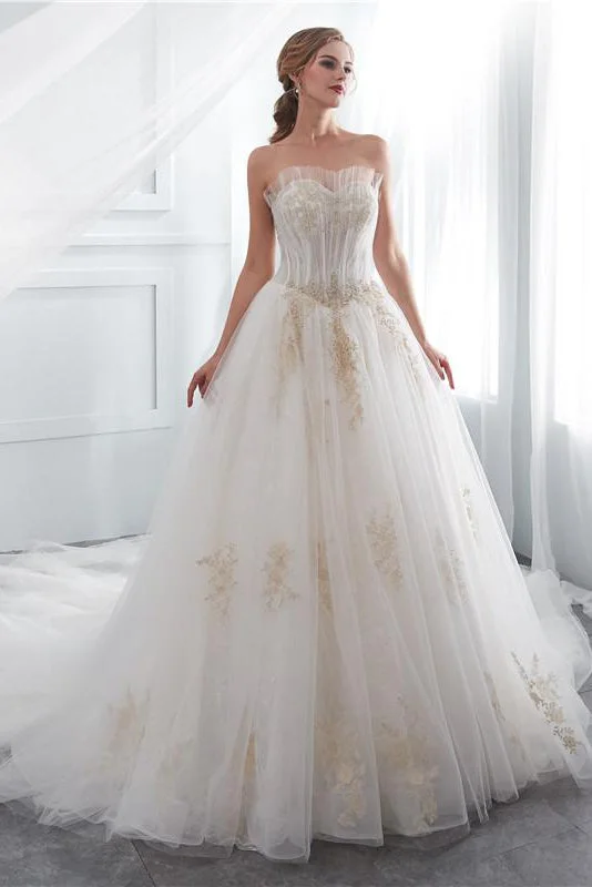 "Trendy casual dresses for women to wear at the beach"Long Lace-Up A-line Strapless Ivory Wedding Dress with Gold Appliques