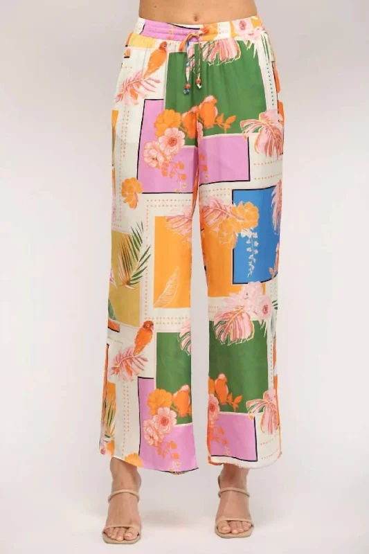 Velvet wide leg jeans for women in a luxurious and trendy styleTropical Print Wide Leg Pant In Orange Multi Velvet wide leg jeans for women in a luxurious and trendy styleTropical Print Wide Leg Pant In Orange Multi